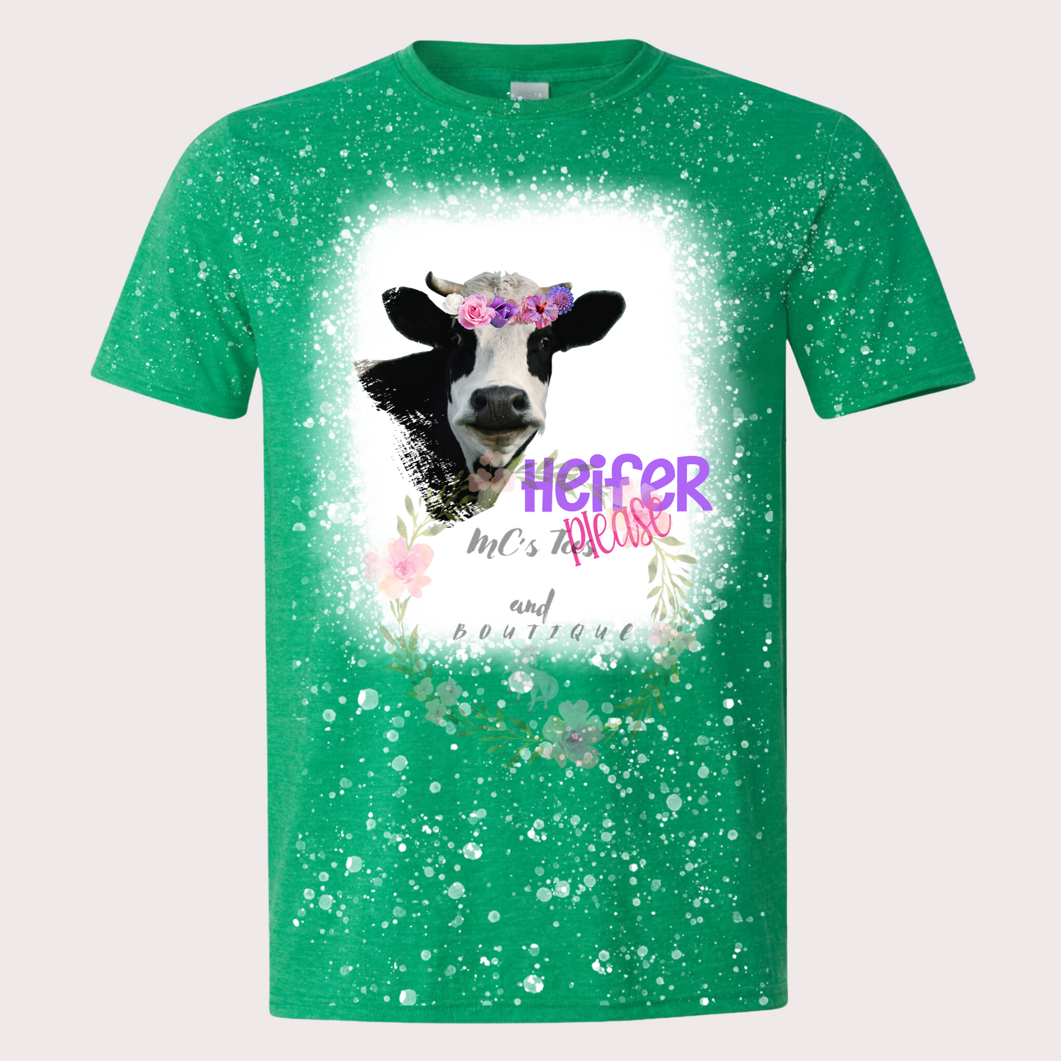 Bleached sublimation T-shirt with the text 'Heifer Please,' featuring a vibrant cow head design on a Heather Irish Green shirt.