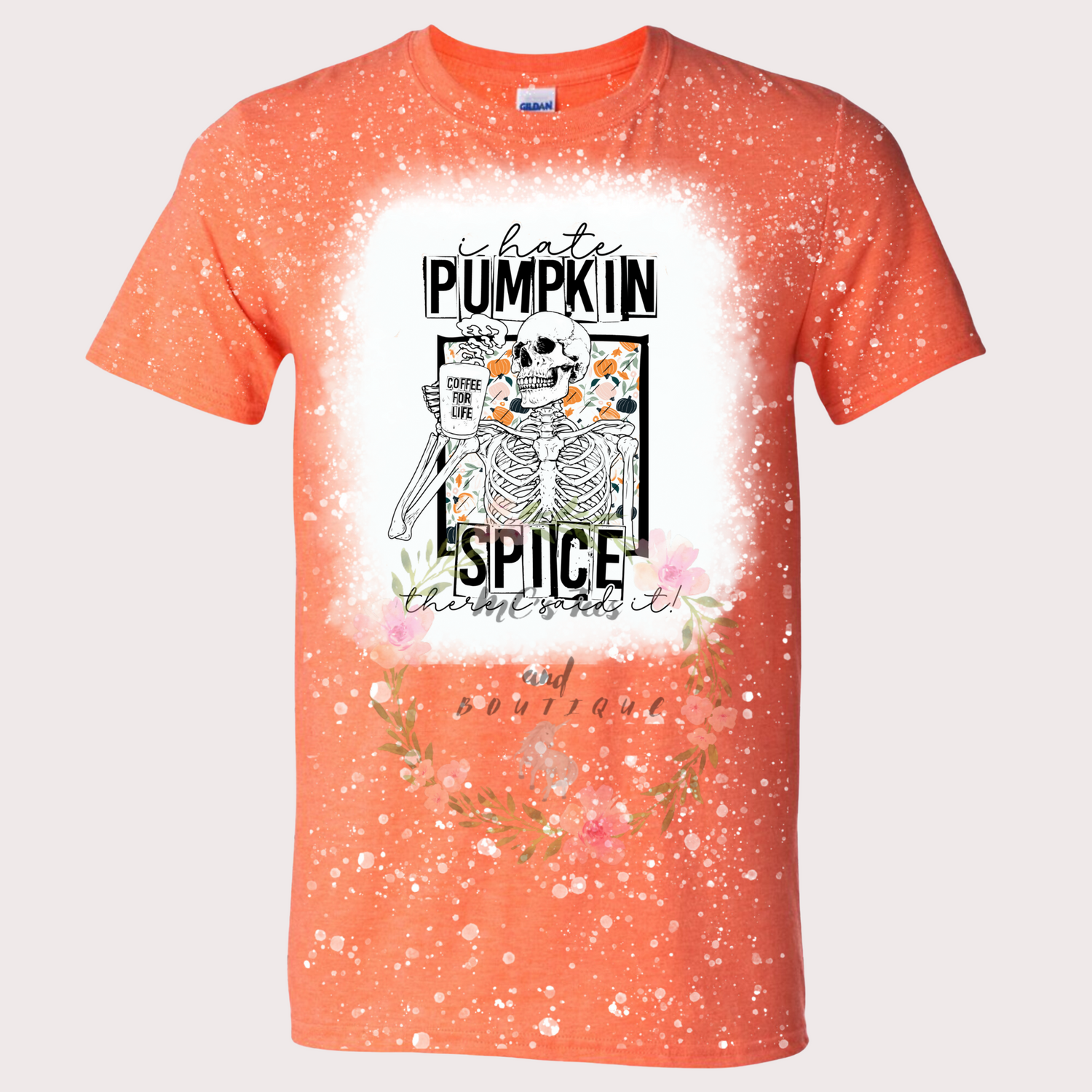 Bright orange bleached sublimation T-shirt with the phrase 'I Hate Pumpkin Spice' featuring a skeleton holding a coffee cup labeled 'Coffee for Life,' surrounded by floral accents. The shirt has a unique speckled bleach design and a bold, humorous style, perfect for showcasing personality.